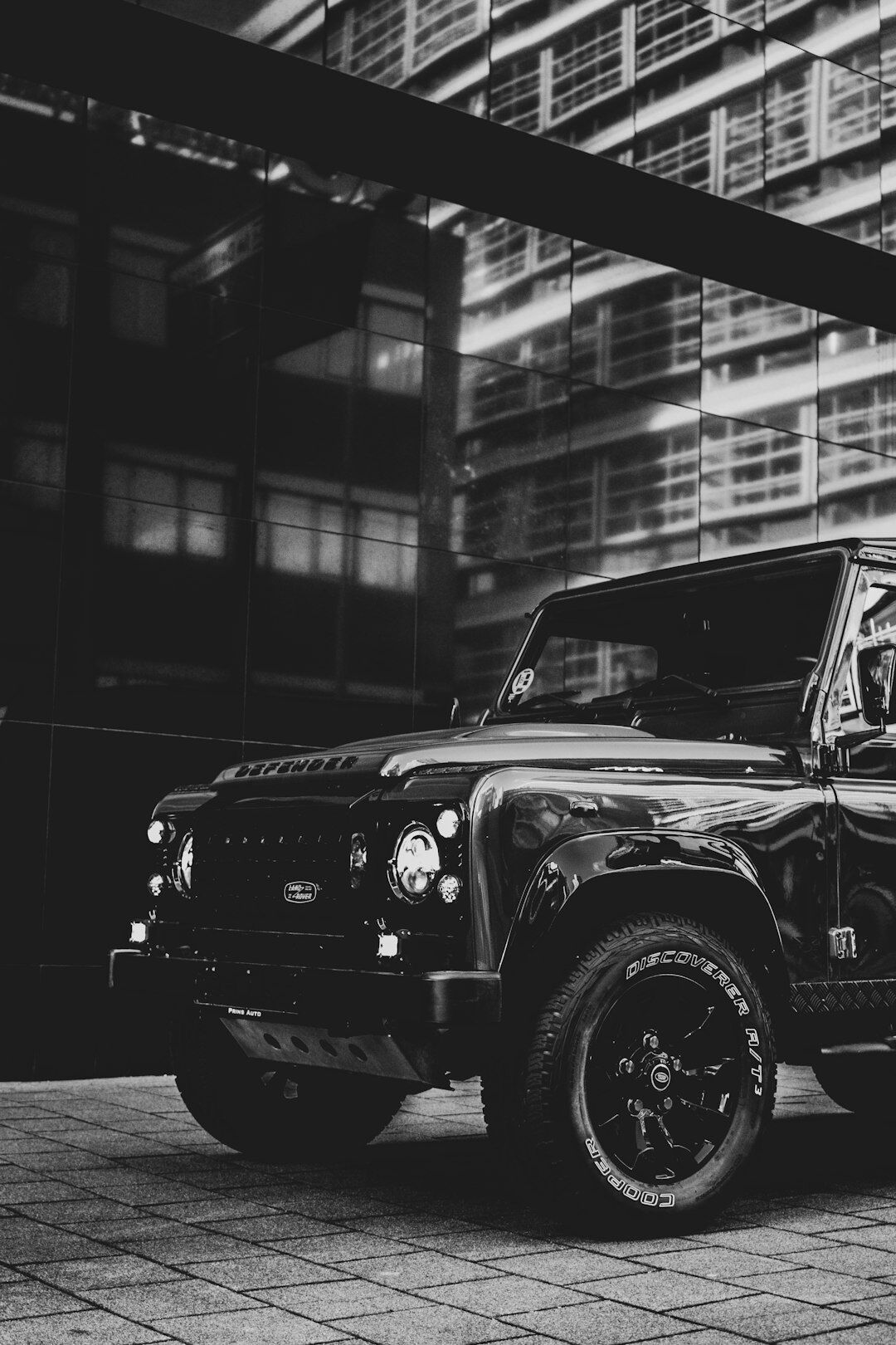Black Range Rover Autobiography luxury SUV under city lights at night