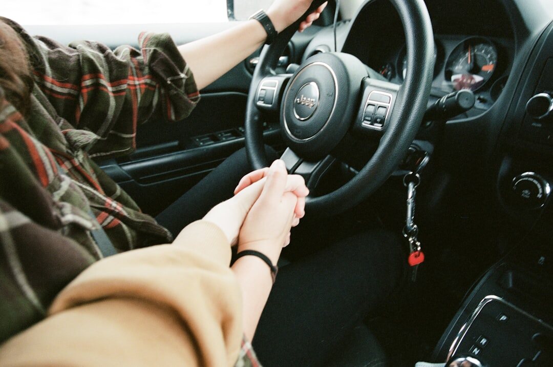 Uruguayan man handing over car keys to another person outdoors