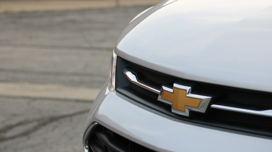White Chevrolet Tracker compact SUV outside a modern showroom