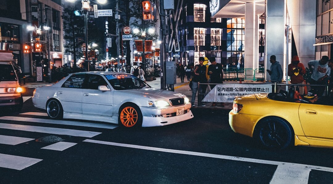 Japanese sports car parked on a Tokyo street with neon lights