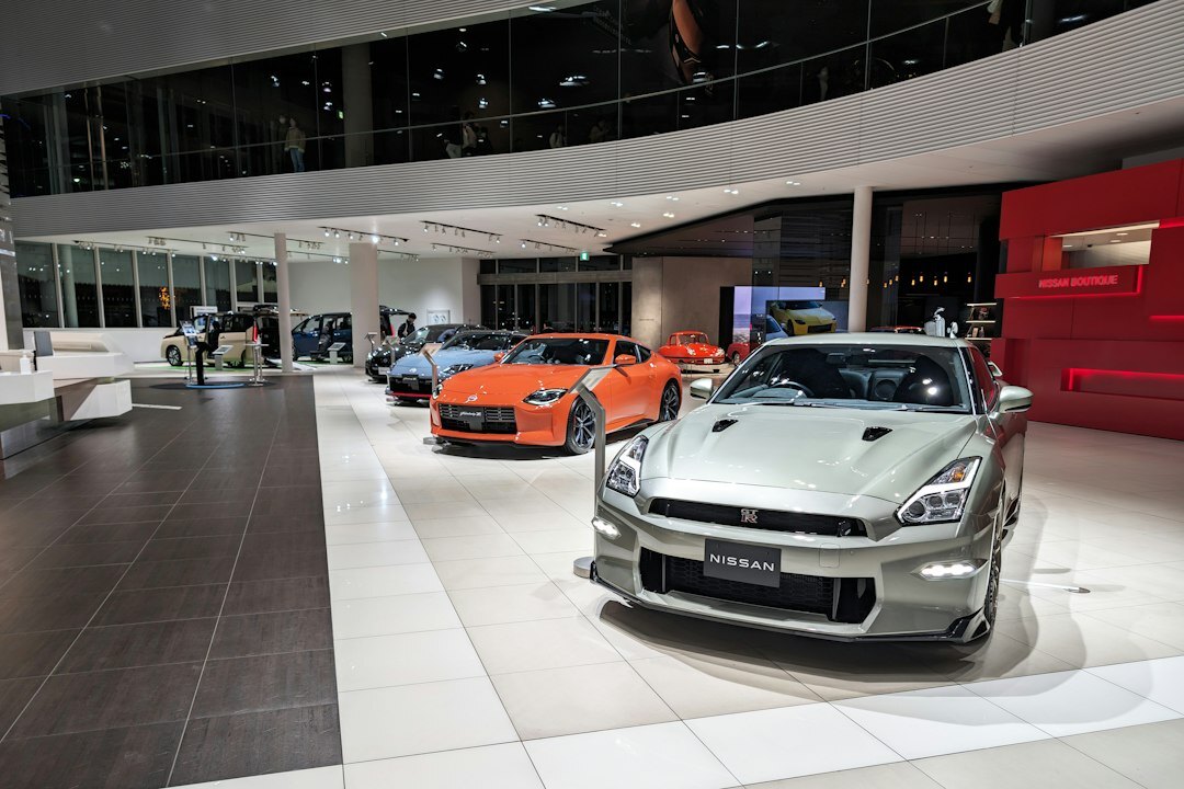 Modern premium car showroom interior with several vehicles on display