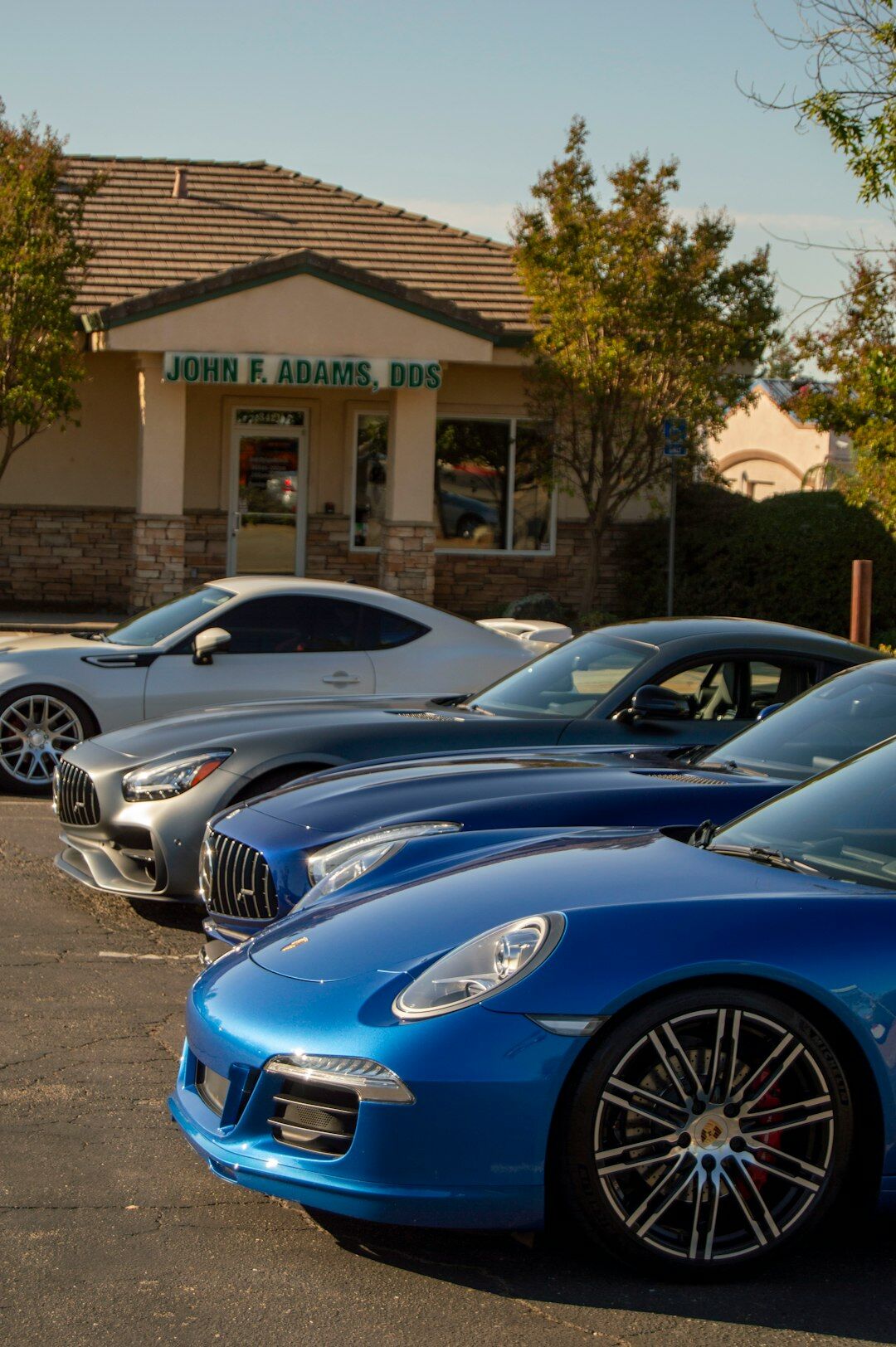 Professional Uruguayan team of automotive advisors standing together in an office